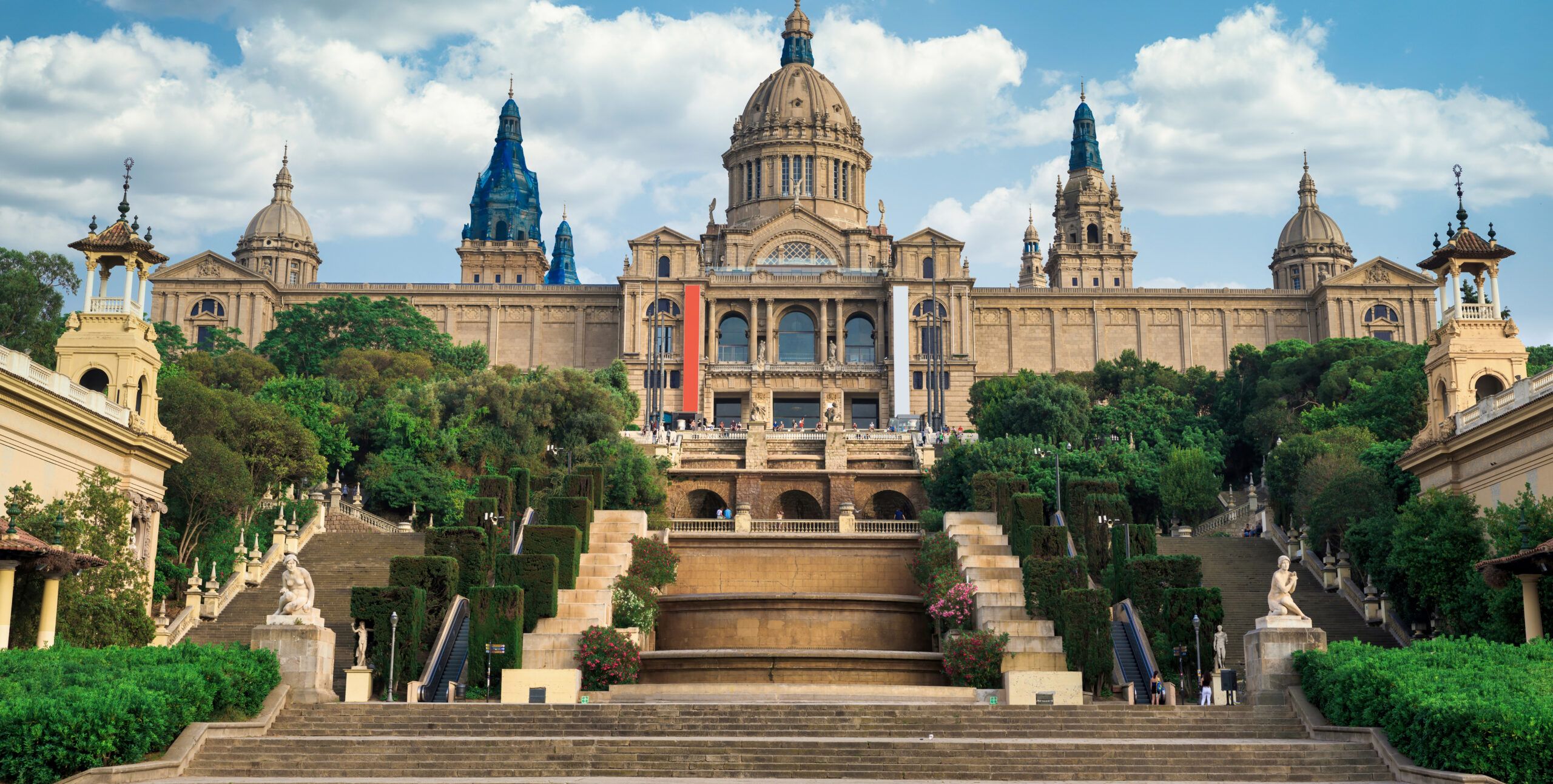 The National Palace, gardens and people in front of it. Cloudy s